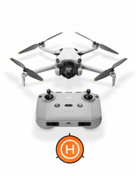 Drone DJI Mini 4 Pro + Kit con su control remoto y landing pad.