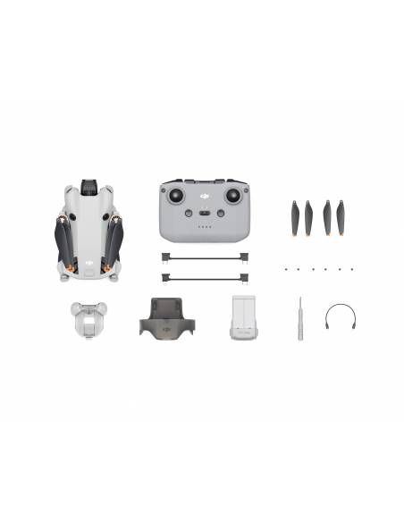 Uno de los Drones DJI Mini 4 Pro + Kit replegado con todas sus partes y piezas dispuestas sobre un fondo blanco.